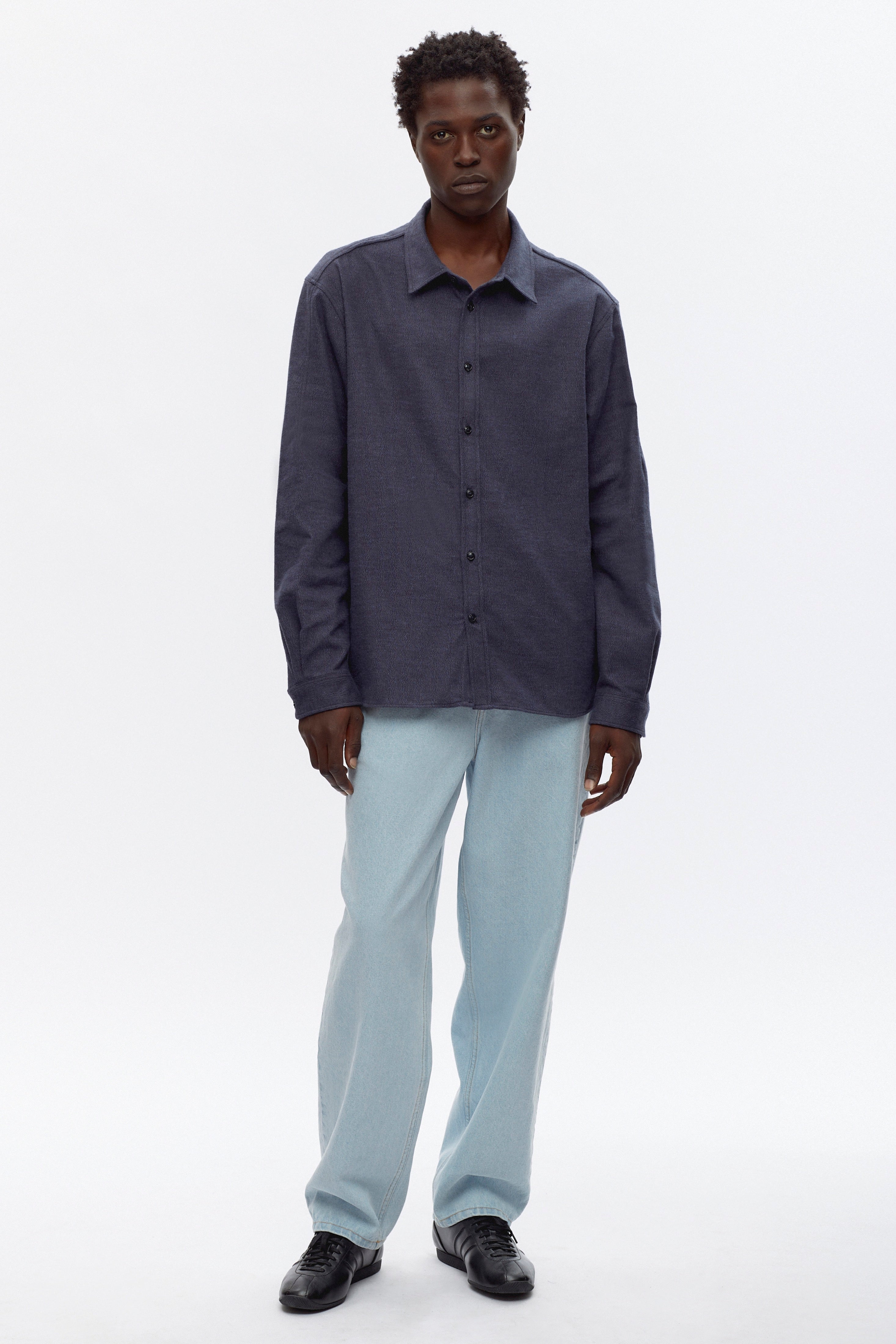 Jonathan is 6’2, a regular L and is wearing an L.