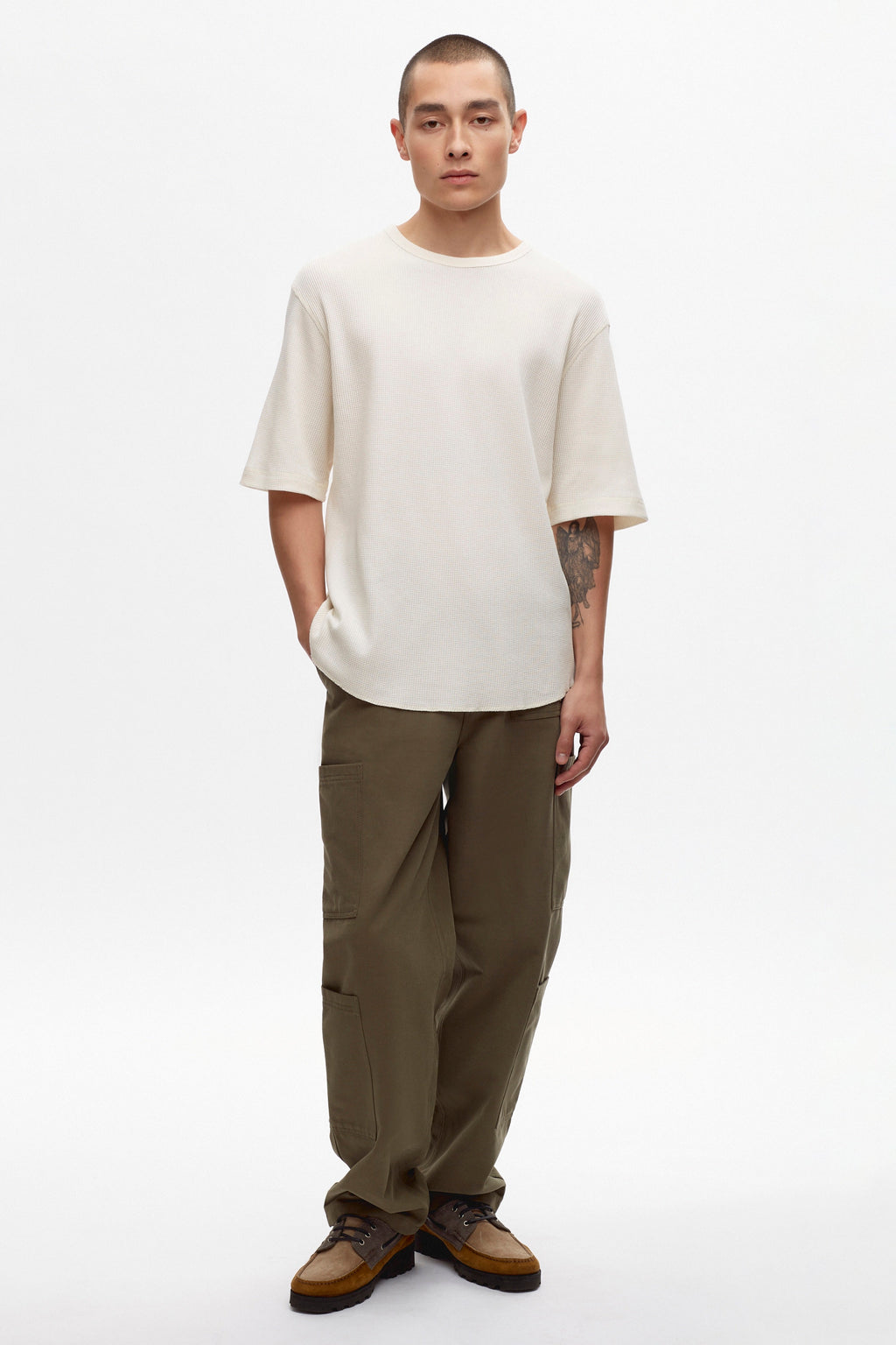 Raphael is 6ft is a regular M, and is wearing an M. 