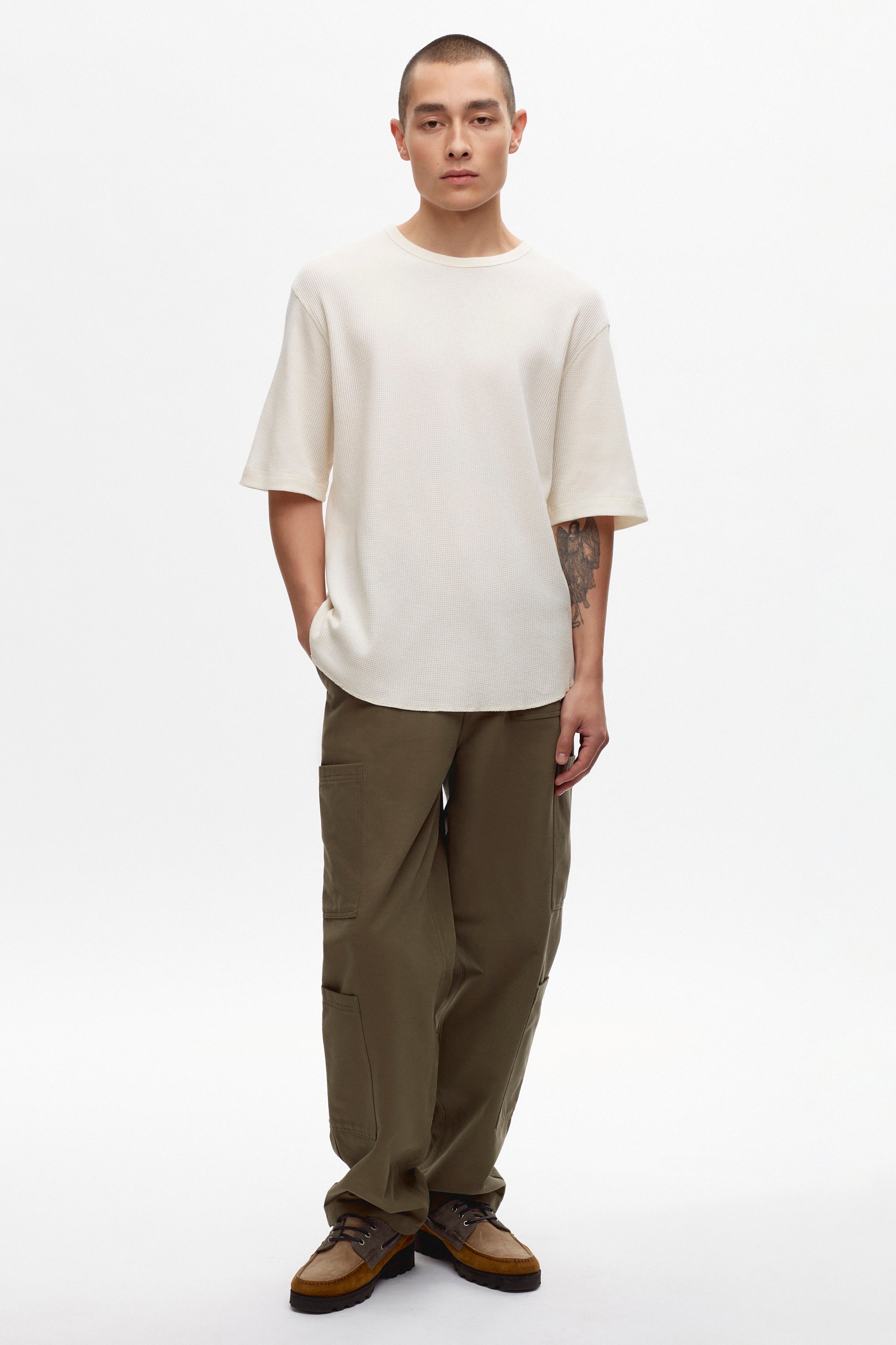 Raphael is 6ft is a regular M, and is wearing an M. 