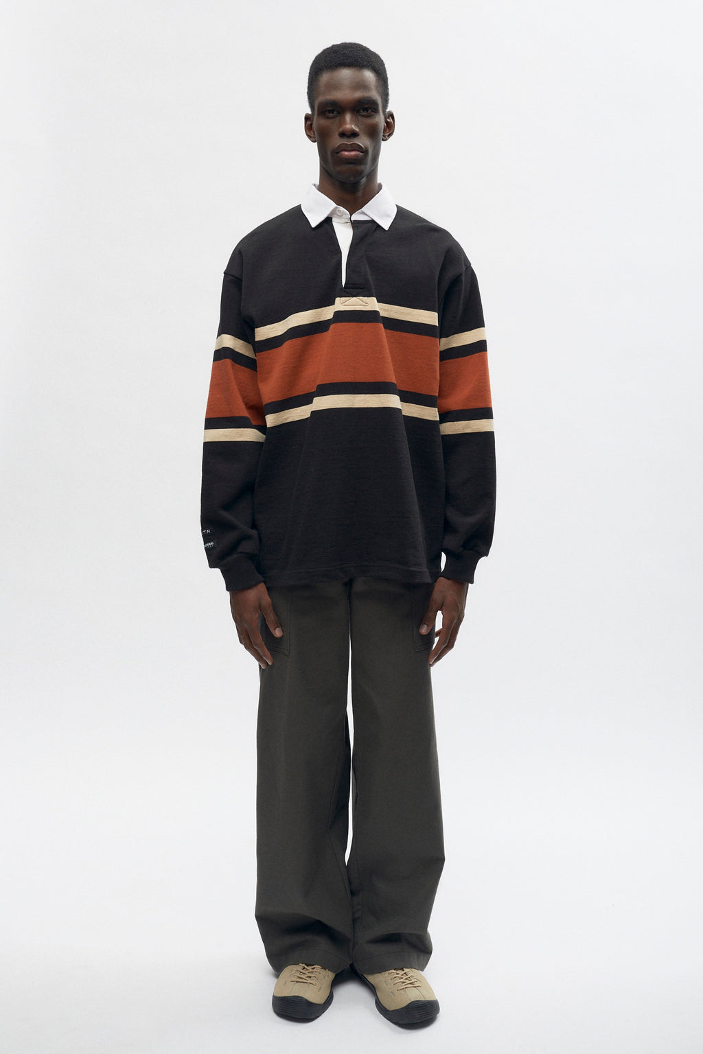 Abraham is 6ft is a regular M and is wearing an L.