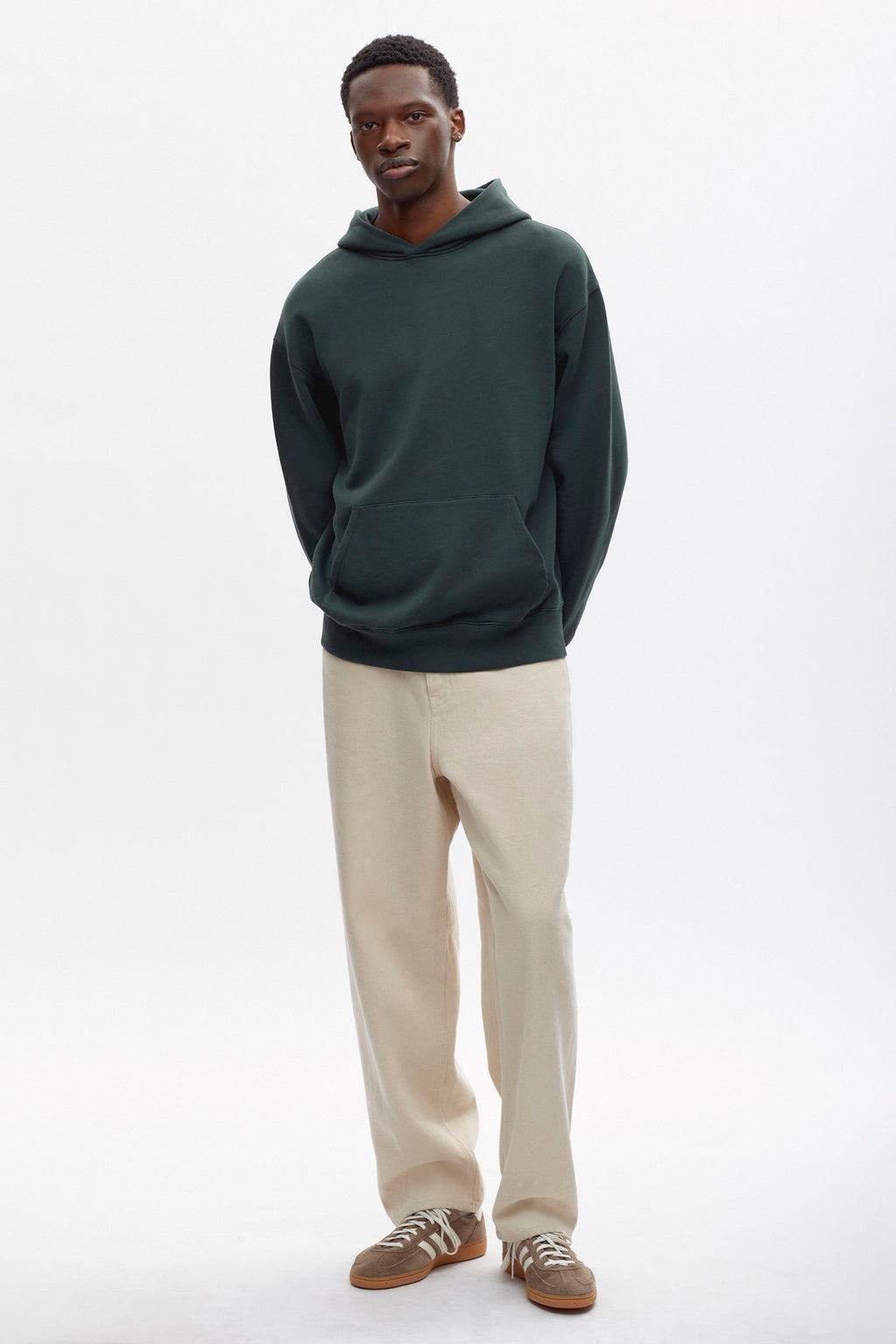 Rukundo is 6'1 a regular M and wearing an M.