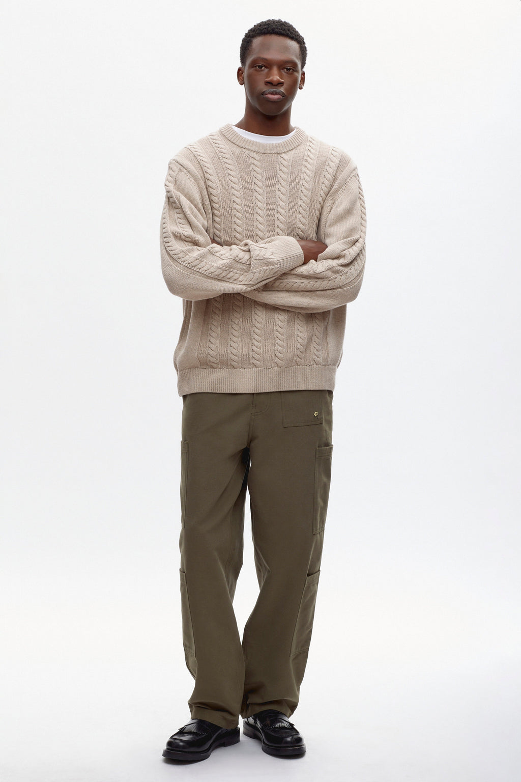 Rukundo is 6'1, is a regular L and is wearing a L.