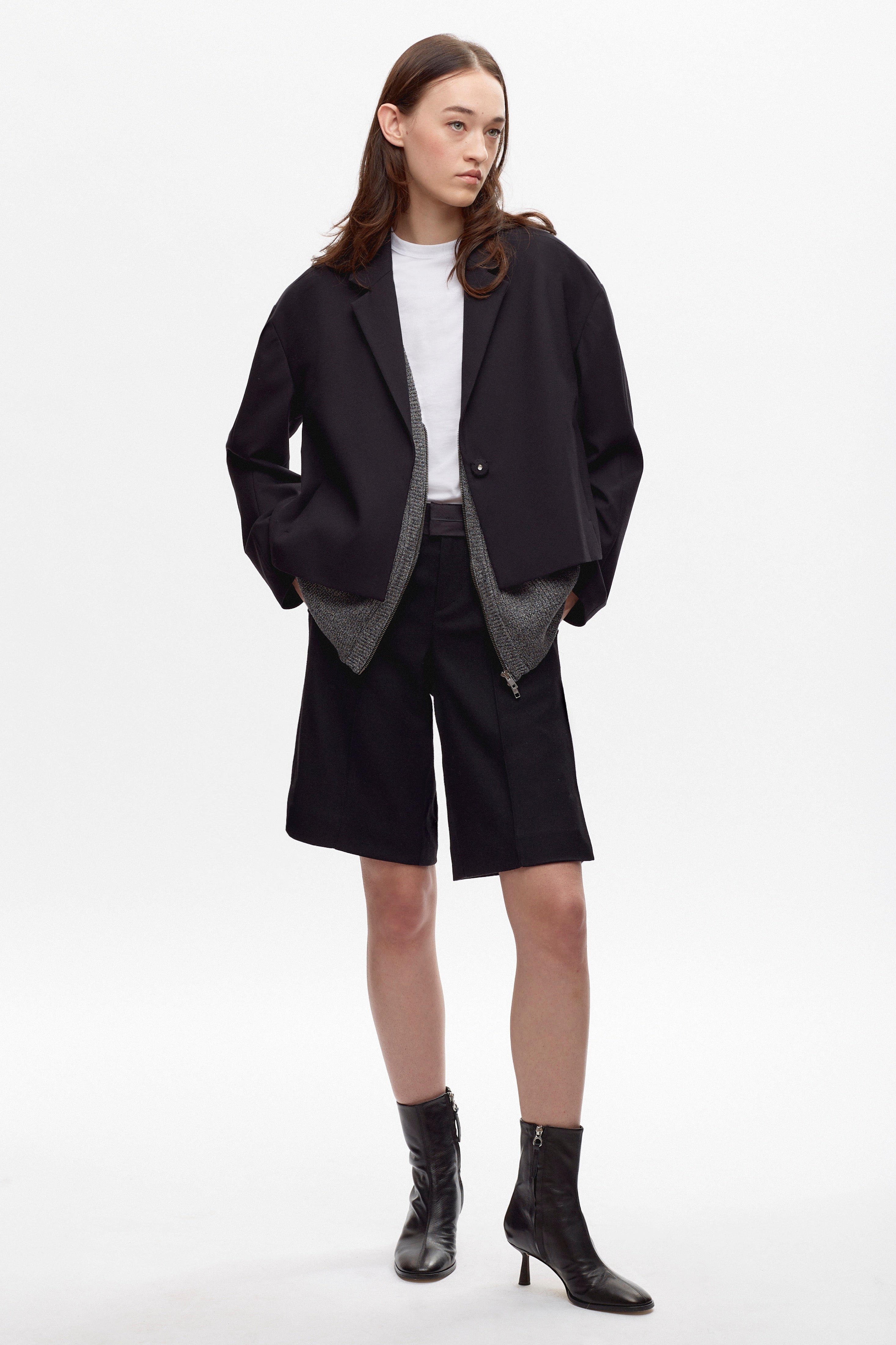 Elizabeth is 5’11" is a regular XS and is wearing an S.